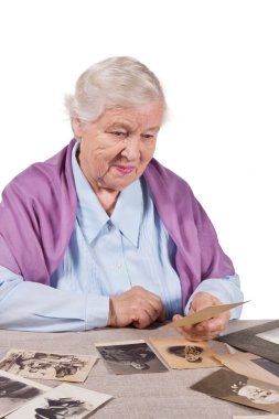 woman looking old photographs