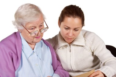 mother with daughter looking photos