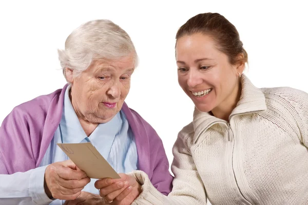 Mother with daughter looking photos — Stock Photo, Image