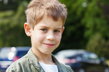 Blond boy in park