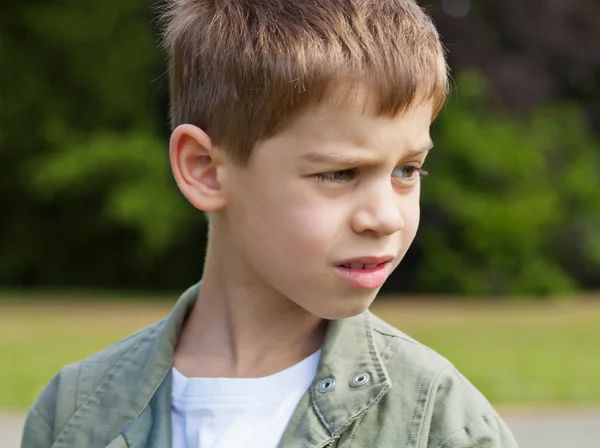 Blond boy in park — Stock Photo, Image
