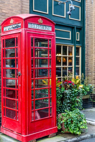 Red Phone Booth by Green Pub — Stock Photo, Image