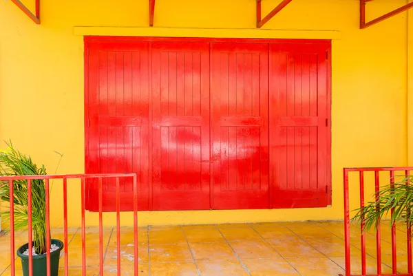 Red Doors on Yellow Wall — Stock Photo, Image