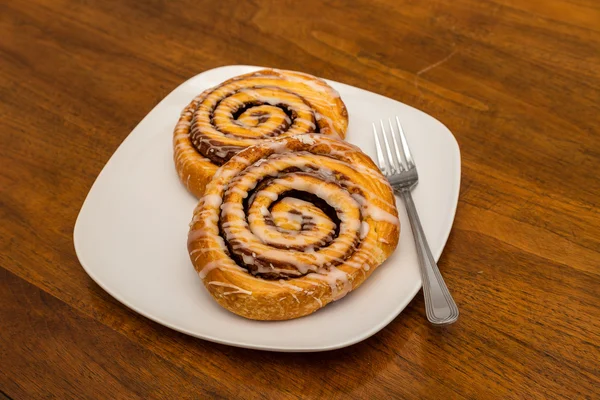Two Cinnamon Rolls on White Plate with Fork — Stock Photo, Image