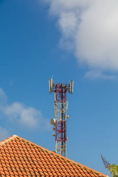 Cell Tower Over Tile Roof — Stock Photo, Image