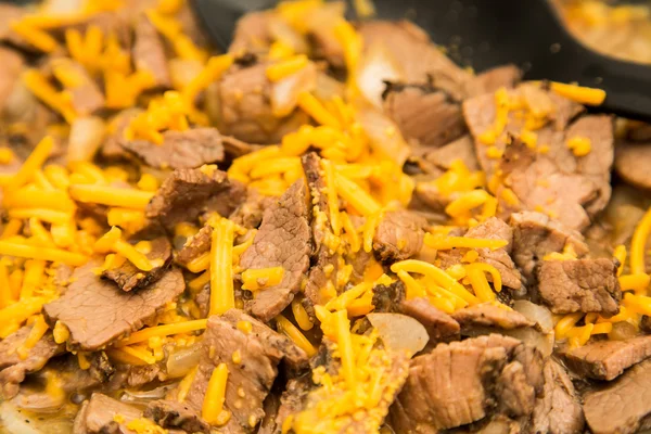 Sliced Beef and Onions with Shredded Cheese — Stock Photo, Image