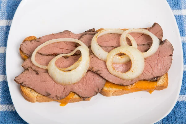 Rare Roast Beef and Sliced Onion Sandwich on White Plate — Stock Photo, Image