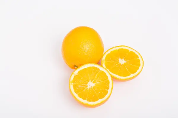 Whole and Half Oranges on White — Stock Photo, Image