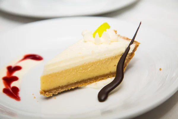 Chocolate Straw and Raspberry Sauce Garnishing Pie — Stock Photo, Image