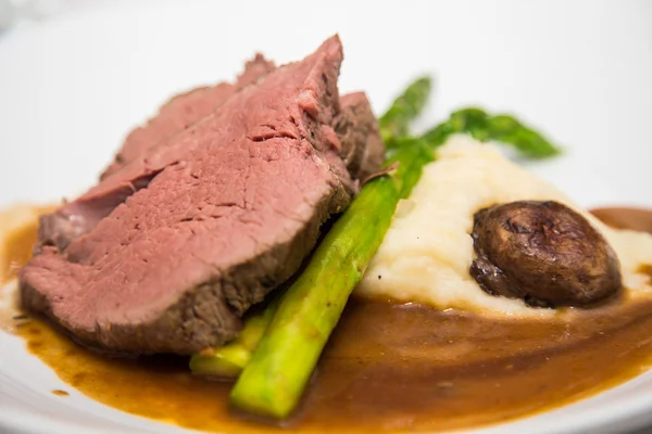 Prime Rib with Stalk of Asparagus — Stock Photo, Image