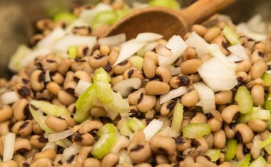 Stirring Black-Eyed Peas with Onions and Celery clipart