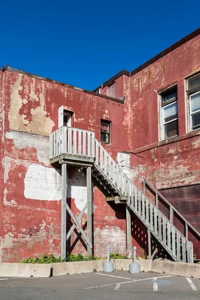 Wood Stairs on Old Red Plaster