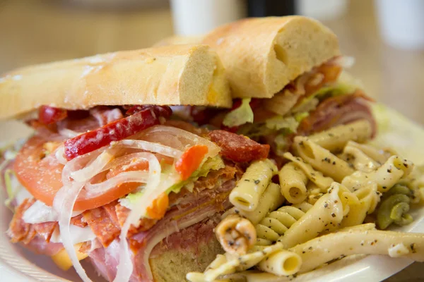 Sub Sandwich on French Bread with Pasta Salad — Stock Photo, Image