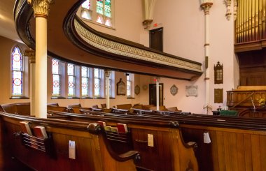 Church Pews Under Curved Balcony clipart