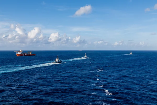 Tugboats Sailing Past Orange Tanker — Stock Photo, Image