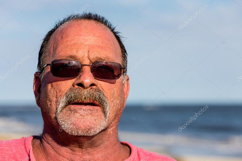 Old Guy on the Beach with Sunglasses — Stock Photo © dbvirago 75728017