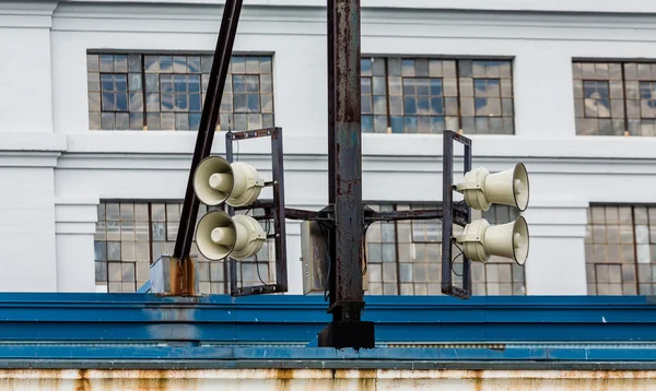 Loudspeakers on Old Warehouse — Stock Photo, Image