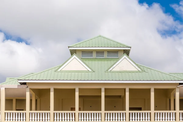 Green Metal Roof on Yellow Plaster Building — Stock Photo, Image