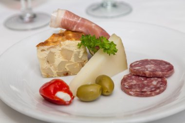 Salami Quiche and Parmesan Cheese on Antipasti Plate