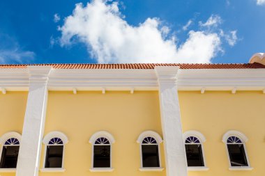 Yellow Plaster Under Blue Skies