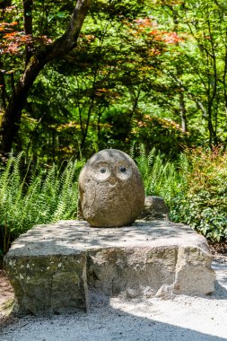 Stone Owl in Garden
