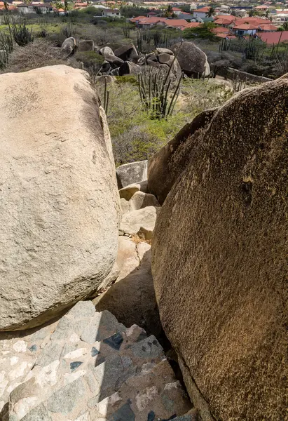 Cleft in Boulders Overlooking Houses — Stock Photo, Image