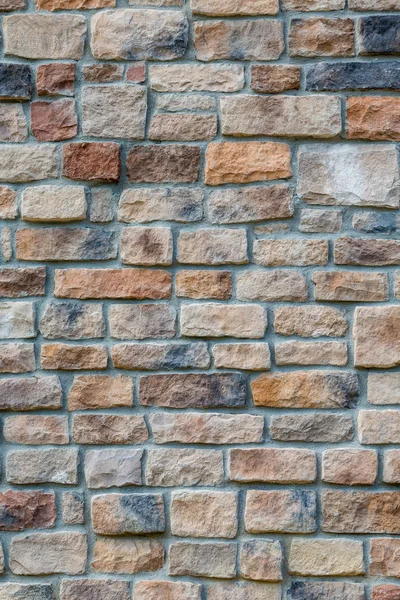 Gri harç ile renkli taş duvar — Stok fotoğraf