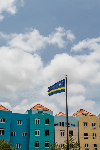 Curacao Flag by Colorful Buildings — Stock Photo, Image