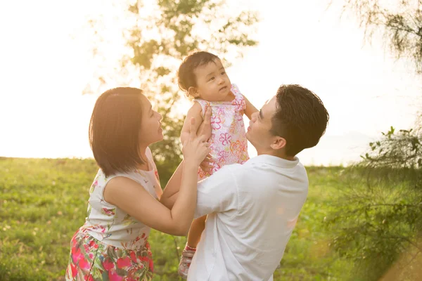 Asian family playing at park — Stock Photo, Image