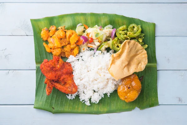 Indian banana leaf rice on table — Stock Photo, Image
