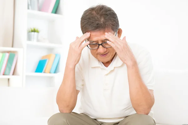 Mature Asian man headache — Stock Photo, Image