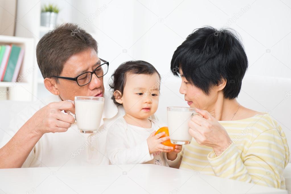 Asian family drinking milk