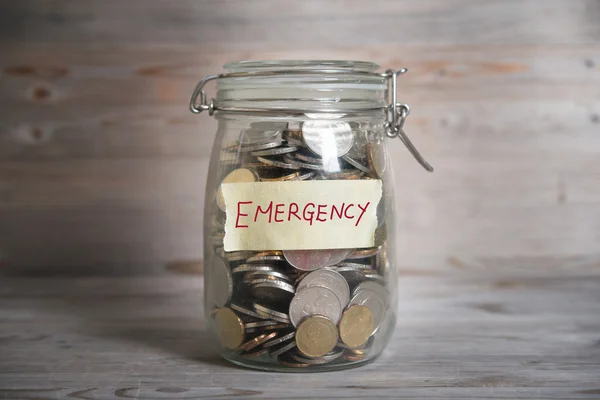 Money jar with emergency label. — Stock Photo, Image