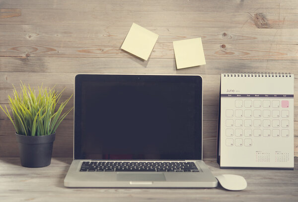 Wooden working table with laptop