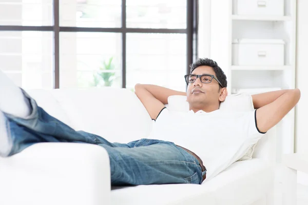 Indian guy resting and daydreaming at home — Stock Photo, Image