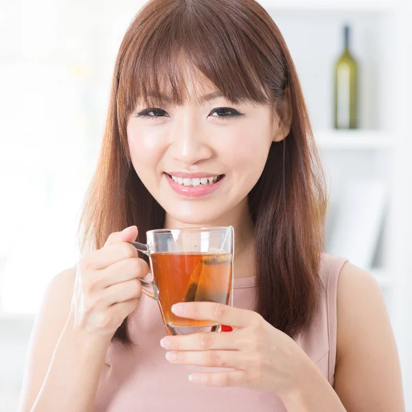 Asian girl enjoying tea — Stock Photo, Image