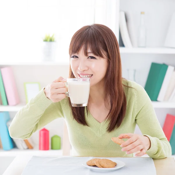 Asian female drinking milk — Stock Photo, Image