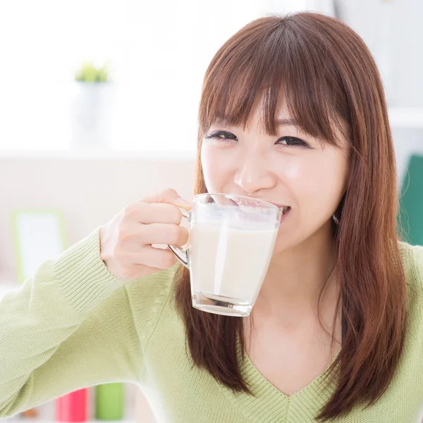 Asian female drinking milk — Stock Photo, Image