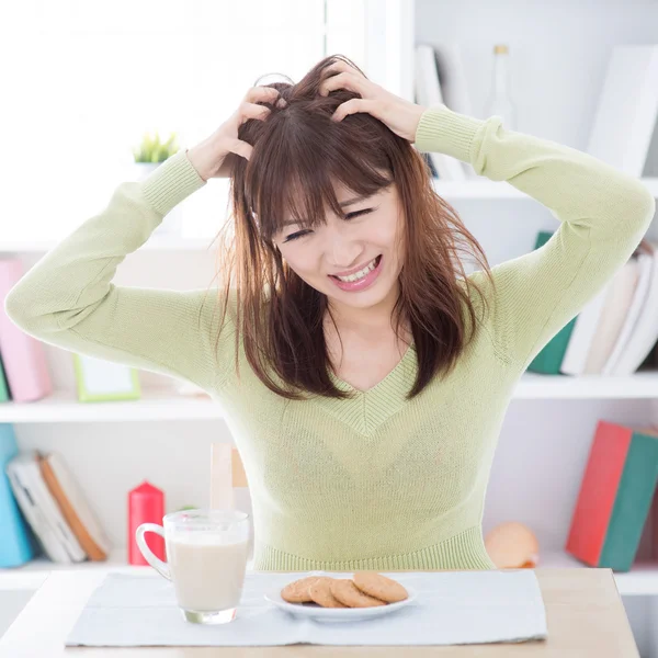 Asian girl feeling bored with her breakfast — Stock Photo, Image