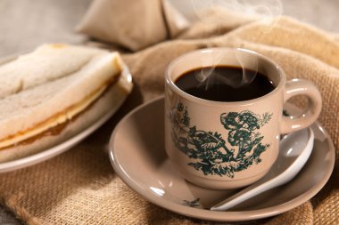 Traditional Malaysian Chinese dark coffee and breakfast
