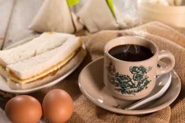 Traditional Singaporean Chinese dark coffee and breakfast