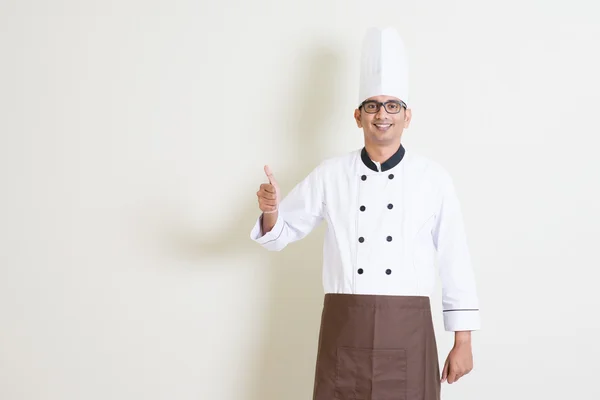 Handsome Indian male chef in uniform thumb up — Zdjęcie stockowe