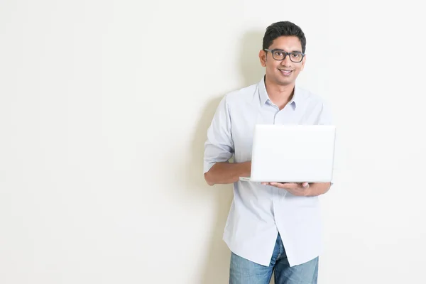 Casual business Indian male using laptop — Stok fotoğraf