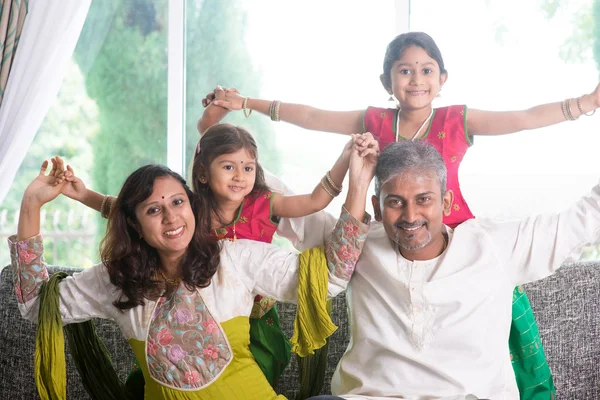 Happy Indian family playing at home — ストック写真