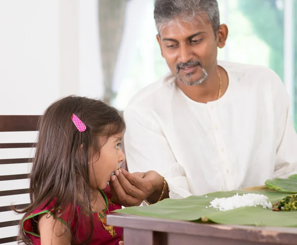 Father feeding child — Stok fotoğraf