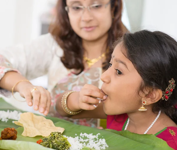 Indian girl eating — Stok fotoğraf