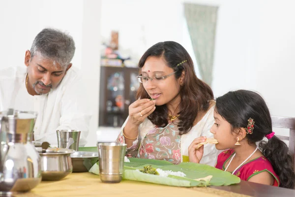 Indian family eating banana leaf rice — ストック写真