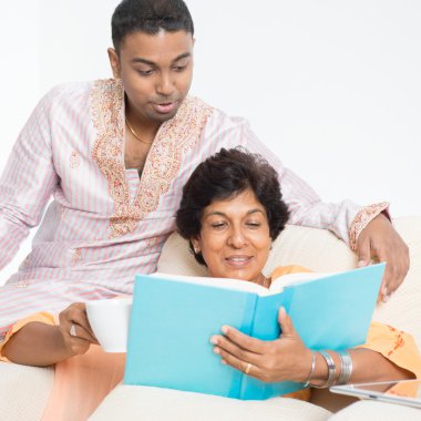 Indian family reading book together