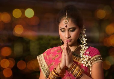 Indian girl praying clipart