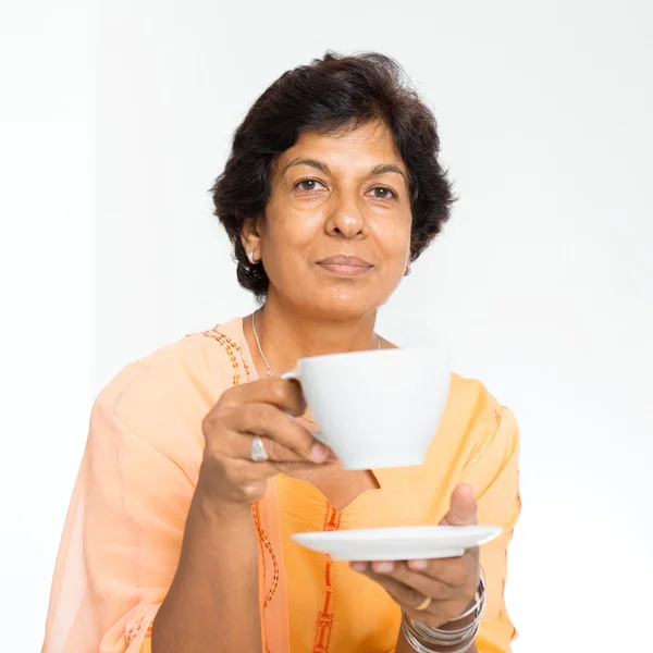 Indian mature woman drinking coffee — Stock Fotó